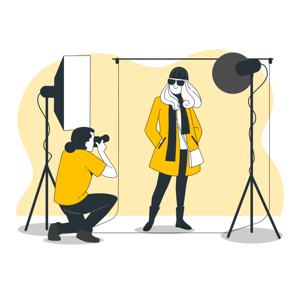 Fashion photoshoot with a model posing in a studio setup with professional lighting